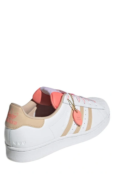 Shop Adidas Originals Superstar Sneaker In White/ Halo Blush/ Acid Red