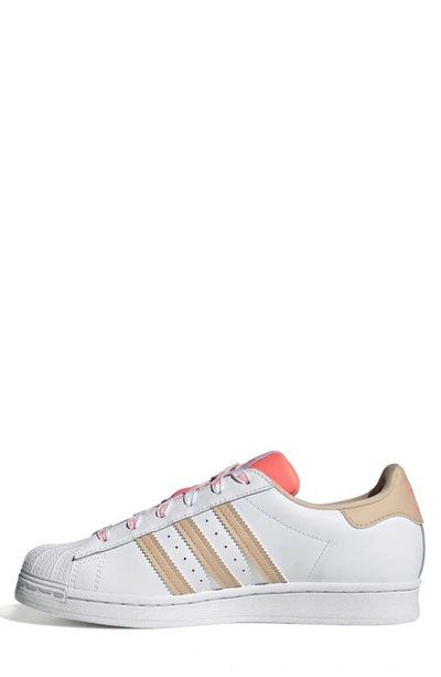 Shop Adidas Originals Superstar Sneaker In White/ Halo Blush/ Acid Red