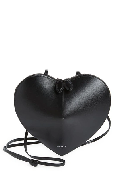 Shop Alaïa Le Coeur Leather Crossbody Bag In 999 - Noir