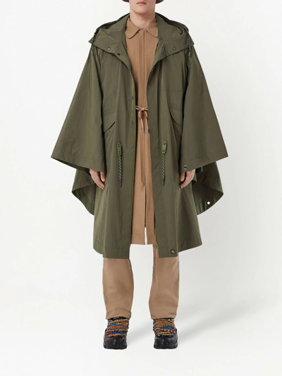 Shop Burberry Packaway Hooded Cape In Green