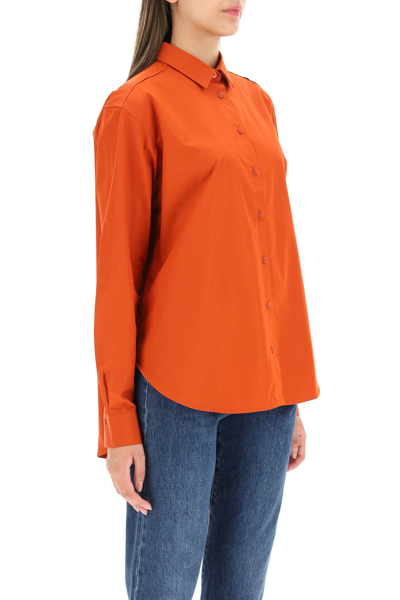 Shop Totême Logo-embroidered Cotton Shirt In Orange