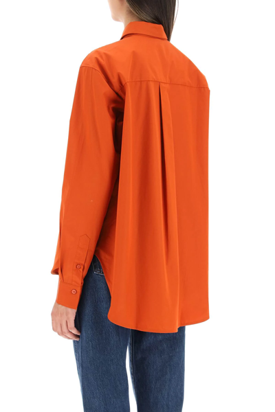 Shop Totême Logo-embroidered Cotton Shirt In Orange
