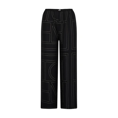 Shop Totême Monogram Pyjama Silk Pants In Black Monogram