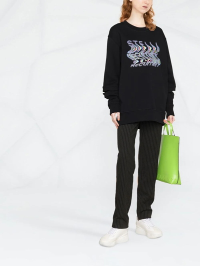 Shop Stella Mccartney Warped-logo Oversized Sweatshirt In Black