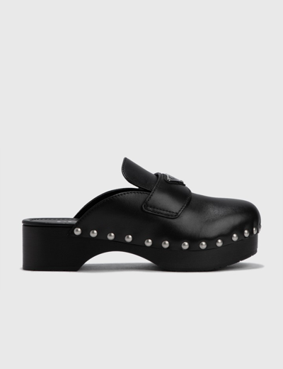 Shop Prada Leather Clogs In Black