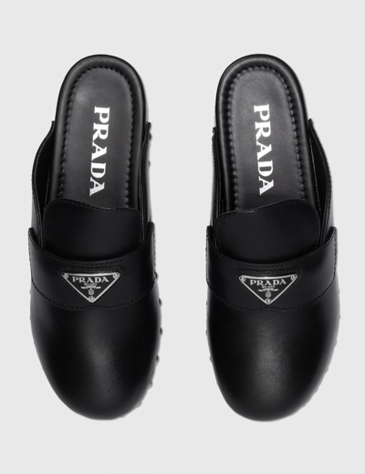 Shop Prada Leather Clogs In Black