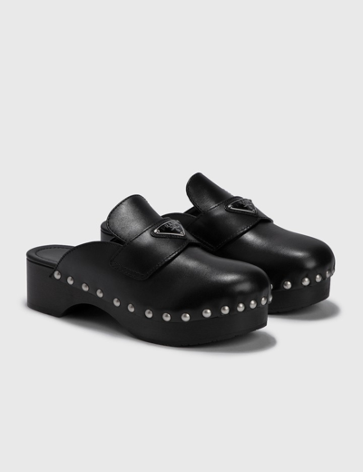 Shop Prada Leather Clogs In Black