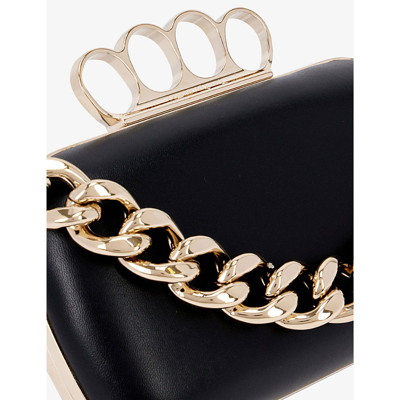 Shop Alexander Mcqueen Four-ring Leather Clutch Bag In Black Silver