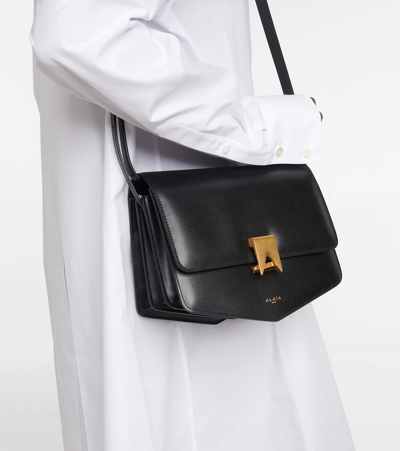 Shop Alaïa Le Papa Large Leather Crossbody Bag In Black