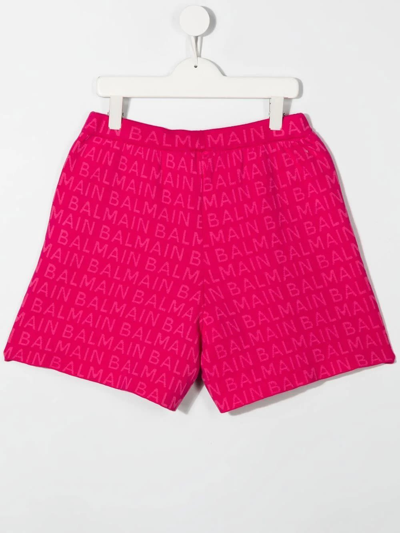 Shop Balmain Kids Fuchsia Shorts With All-over Logo In Fucsia