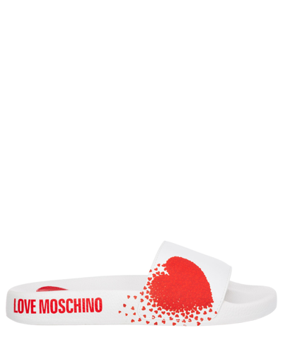 Shop Love Moschino Slides In White