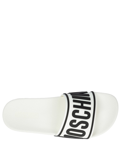 Shop Moschino Slides In White
