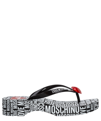 Shop Love Moschino Flip Flops In Black