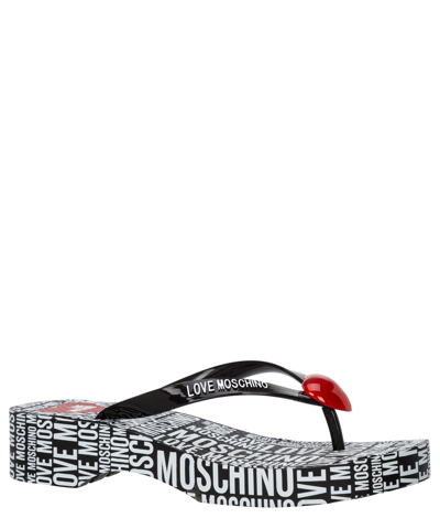 Shop Love Moschino Flip Flops In Black