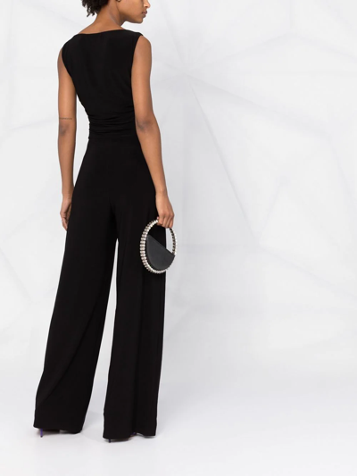 Shop Norma Kamali Tara Plunge-neck Jumpsuit In Black