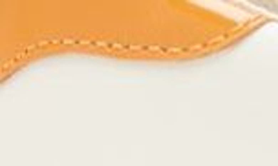 Shop Tory Burch Howell Sneaker In New Ivory / Orange Citrine