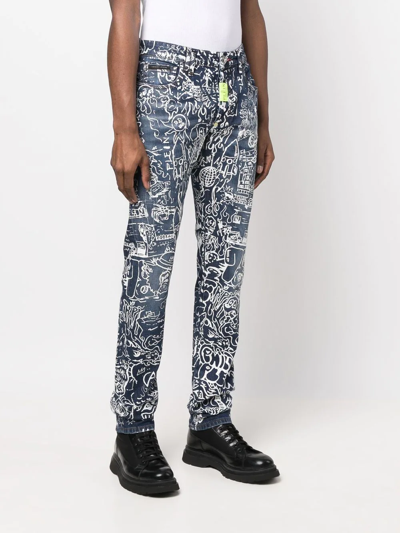 Shop Philipp Plein All-over Graphic-print Jeans In Blue