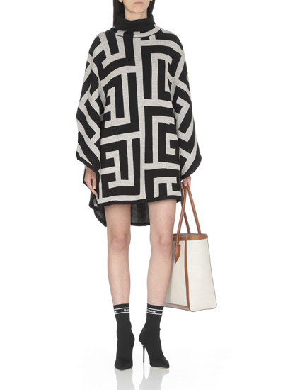 Shop Balmain Knitted Poncho With Monogram In Ivoire/noir