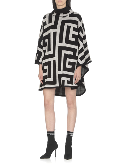 Shop Balmain Knitted Poncho With Monogram In Ivoire/noir