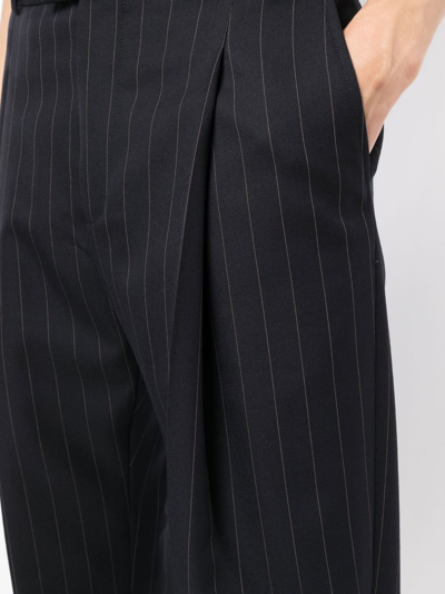 Shop Alexander Mcqueen Pinstripe Pleat-detail Tailored Trousers In Blue