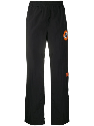 Shop Heron Preston Logo-print Trousers In 1020 Black Orange