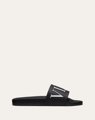 Shop Valentino Garavani Vltn Rubber Slider Sandal In Black/white