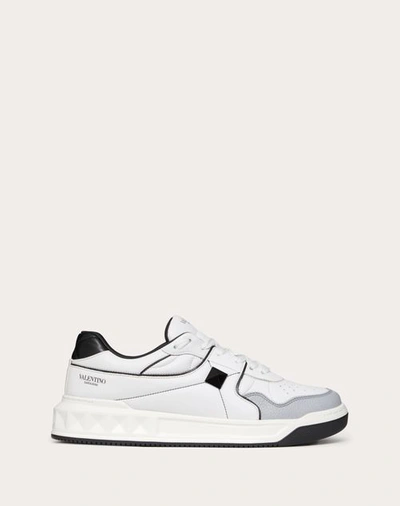 Shop Valentino Garavani One Stud Low-top Nappa Sneaker In White/ Black