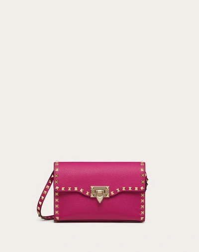 Shop Valentino Garavani Small Rockstud Grainy Calfskin Crossbody Bag Woman Rose Violet Uni