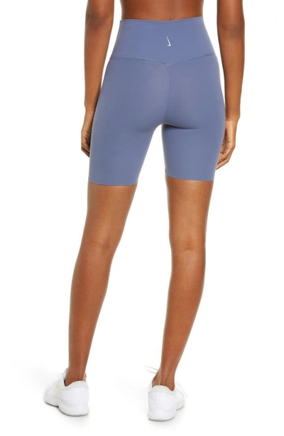 Shop Nike Yoga Luxe Tight Shorts In Dfsdbl/ Irngry