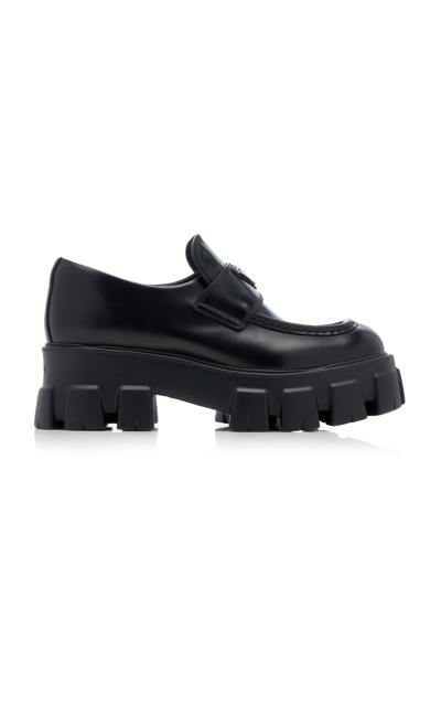 Shop Prada Monolith Leather Loafers In Black