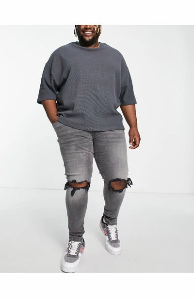 Asos Design Ripped Skinny Jeans In Black