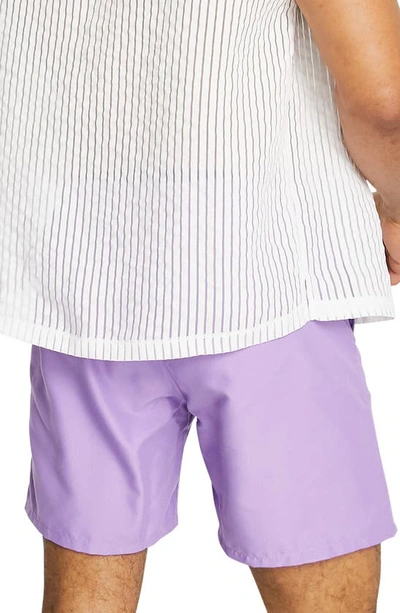 Shop Asos Design Mid-length Solid Swim Trunks In Lilac