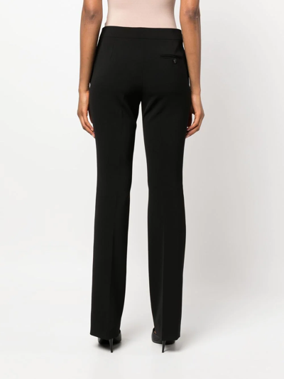 Shop Moschino Flared Mid-rise Trousers In Schwarz