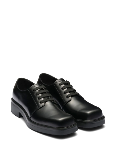 Shop Prada Leather Derby Shoes In Black