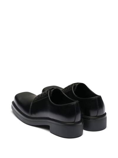 Shop Prada Leather Derby Shoes In Black