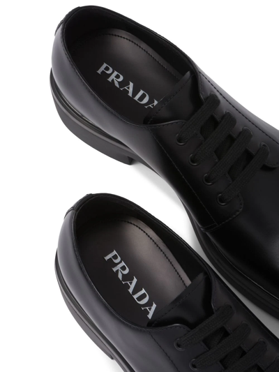 Shop Prada Leather Derby Shoes In Black