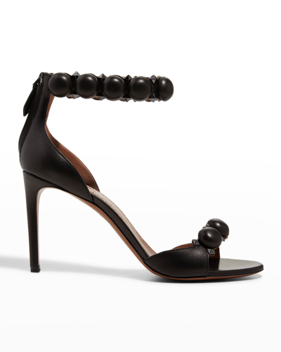 Shop Alaïa La Bombe Stud Ankle-wrap Stiletto Sandals In Noir