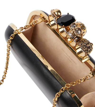 Alexander Mcqueen Skull Four Ring Embellished Clutch In Black
