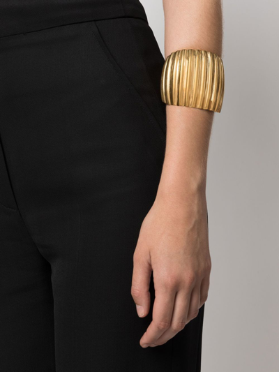 Shop Saint Laurent Oversize Groove Cuff Bracelet In Gold