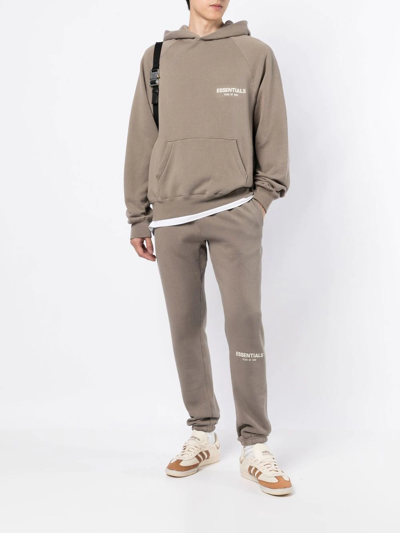 Essentials Logo-print Long-sleeve Hoodie In Brown