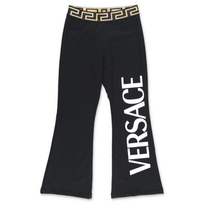 Shop Versace Kids Logo Printed Flared Track Pants In Black