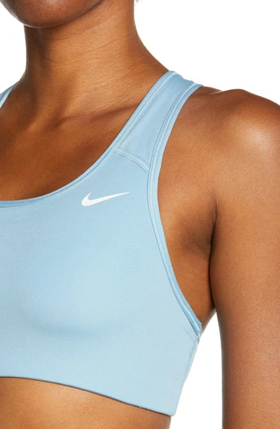 Shop Nike Swoosh Dri-fit Racerback Sports Bra In Worn Blue/ White