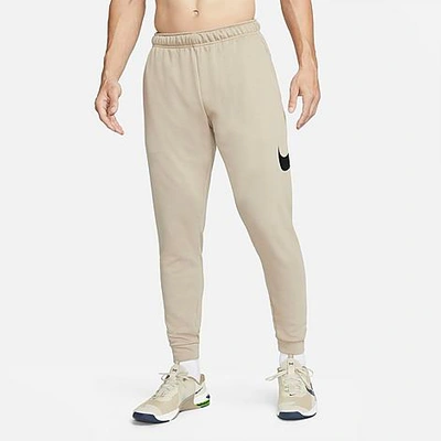 Shop Nike Men's Dri-fit Futura Swoosh Tapered Jogger Pants In Khaki/black