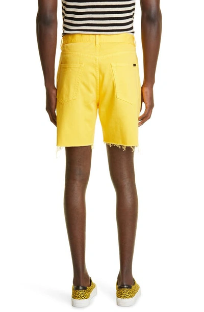 Shop Saint Laurent Stonewash Denim Baggy Shorts In 7040 - Bright Yellow
