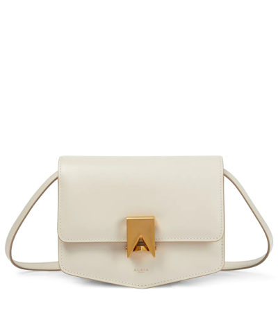 Shop Alaïa Le Papa Small Leather Crossbody Bag In White