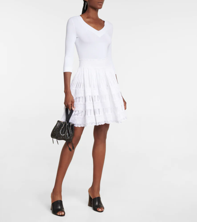 Shop Alaïa Crinoline Pleated Miniskirt In White