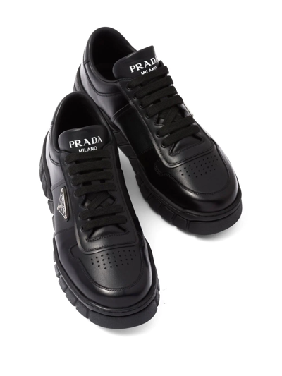 Shop Prada Logo-plaque Low-top Sneakers In Black