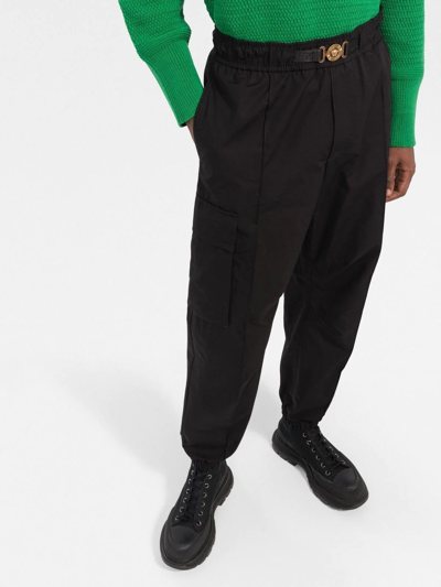 Shop Versace Medusa Plaque Cargo Trousers In Black