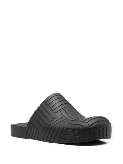 Shop Bottega Veneta Intrecciato Embossed Slides In Schwarz