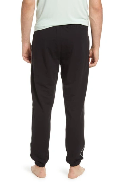 Shop Bedfellow Jogger Pajama Pants In Black With Mint Piping